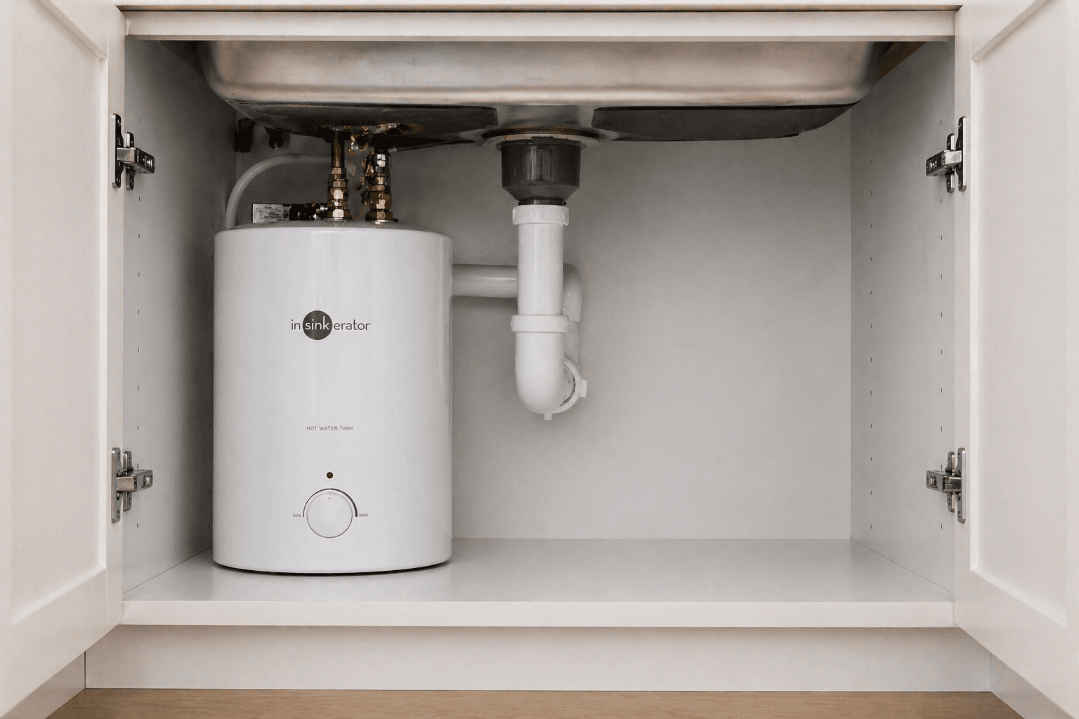 Hot water running from a kitchen tap fed by an aging water heater in an O'ahu home — Alpha Omega Plumbing