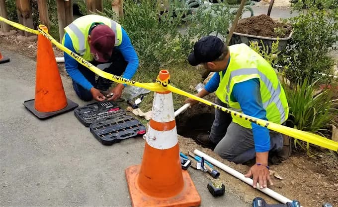 Plumbing technicians working on pipe repair in Honolulu O'ahu — Alpha Omega Plumbing