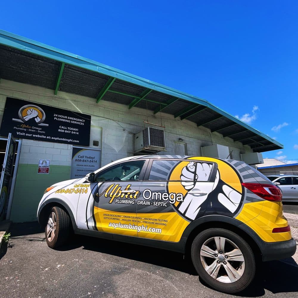 Branded Alpha Omega Plumbing service vehicle outside the company's Honolulu shop on O'ahu — Alpha Omega Plumbing
