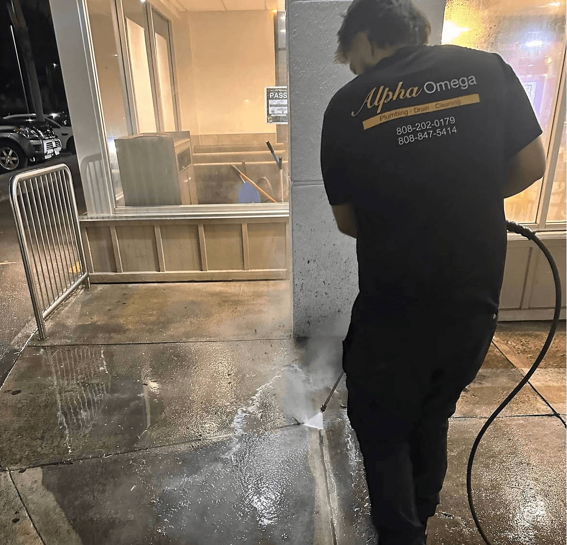 Hydro jetting equipment clearing a blocked main drain line for an O'ahu property — Alpha Omega Plumbing